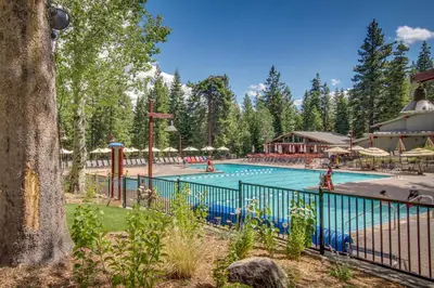 a pool at a resort with people in it at Northstar Original Village Studio One in Truckee