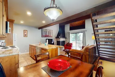 a kitchen and dining room with a table with a red bowl on it at Nordic Retreat in Kings Beach