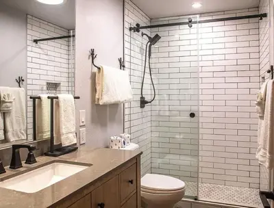 a bathroom with a toilet and a sink and a shower at Streamside Townhome in Kings Beach