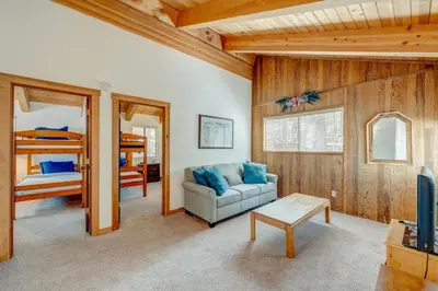 a living room with a couch and a bunk bed at Beaver Pond Northstar Luxury Chalet with Hot Tub in Truckee