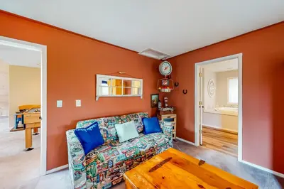 a living room with a couch and a table at Solvang Family Getaway in Truckee