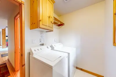 a white washer and dryer in a kitchen at Snowpeak Tahoe Donner Golf Course Views in Truckee