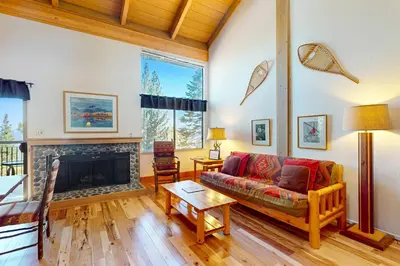 a living room with a couch and a fireplace at View Condo at Northstar in Truckee