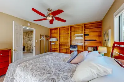 a bedroom with a bed and a ceiling fan at Back Nine Bungalow in South Lake Tahoe