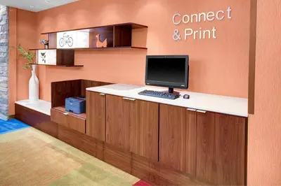 a desk with a computer on top of it at Fairfield Inn & Suites by Marriott Hollister in Hollister