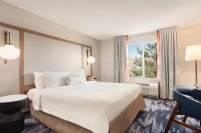 a hotel room with a large bed and a window at Fairfield Inn & Suites by Marriott Reno Sparks in Sparks