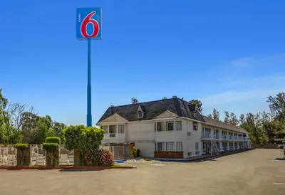 a building with a sign on top of it at Motel 6-Fresno, CA - Belmont Ave in Fresno