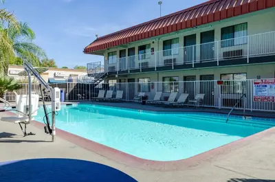 a large swimming pool in front of a hotel at Motel 6-Fresno, CA - Yosemite Hwy in Pinedale