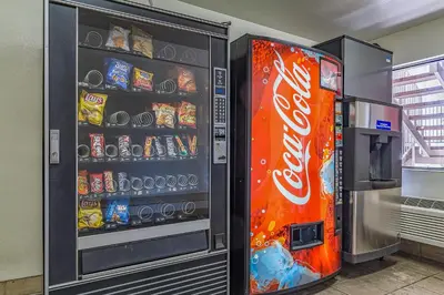 a cocacola soda vending machine in a store at Motel 6-Fresno, CA - Yosemite Hwy in Pinedale