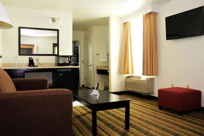 a living room with a couch and a coffee table at Best Western Visalia Hotel in Visalia