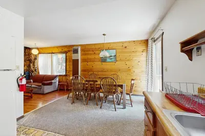 a kitchen and dining room with a table and chairs at Tahoma Getaway in Tahoma