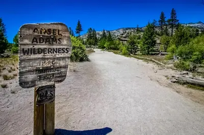 a sign on the side of a dirt road at The Bridges 102 in Mammoth Lakes
