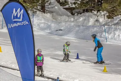 a group of three people on skis in the snow at Wildflower 55 in Mammoth Lakes