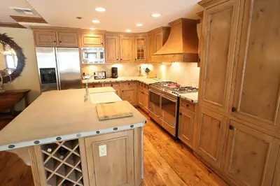 a kitchen with wooden cabinets and a counter top at Silver Bear # 36 in Mammoth Lakes