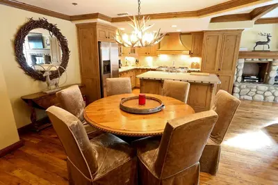 a dining room with a wooden table and chairs at Silver Bear # 36 in Mammoth Lakes