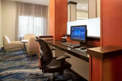 a room with a desk with a computer on it at Fairfield Inn & Suites by Marriott Selma Kingsburg in Kingsburg