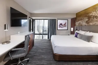a hotel room with a bed and a desk at J Resort in Reno