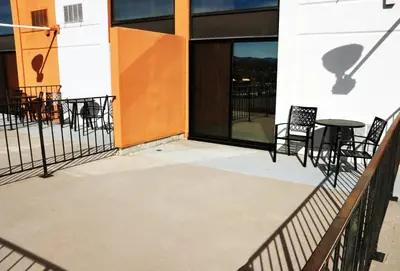 a patio with chairs and a table on a building at J Resort in Reno