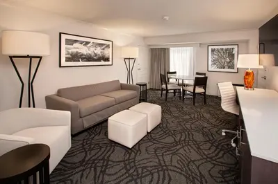 a living room with a couch and a table at J Resort in Reno