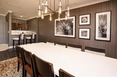 a dining room with a white table and chairs at J Resort in Reno