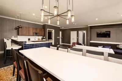 a kitchen and living room with a large white counter top at J Resort in Reno