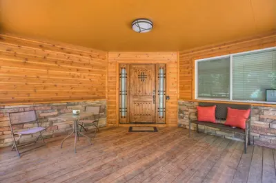 a room with wooden walls and a table and chairs at Prestigious Home South Lake Tahoe in South Lake Tahoe