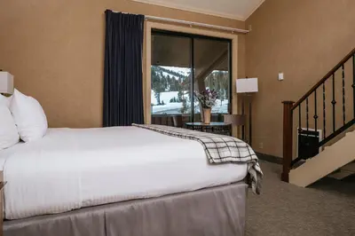 a hotel room with a bed and a window at Mammoth Mountain Inn in Mammoth Lakes