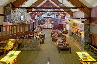 an overhead view of a hotel lobby with couches and tables at Mammoth Mountain Inn in Mammoth Lakes