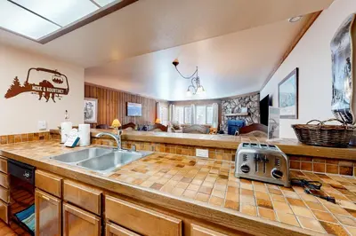 a kitchen with a sink and a counter top at Mountainback 47 in Mammoth Lakes