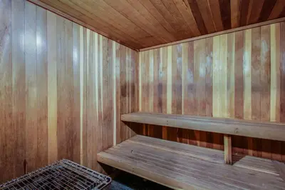 an empty wooden sauna with a bench in it at Mountainback 47 in Mammoth Lakes