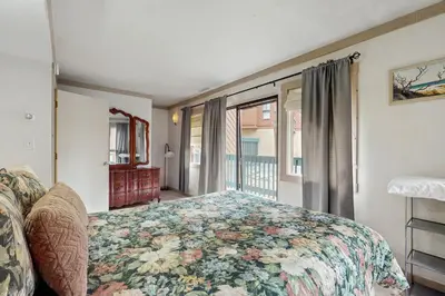 a bedroom with a bed and a window at Saddle Road Condo in Bijou Park