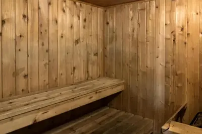 a wooden sauna with a wooden bench in it at The Summit 206 in Old Mammoth