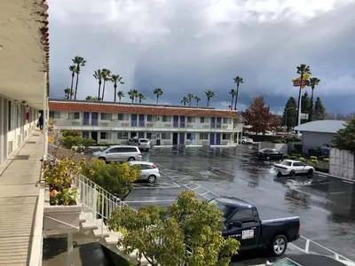 a parking lot in front of a hotel at Gilroy Inn in Gilroy