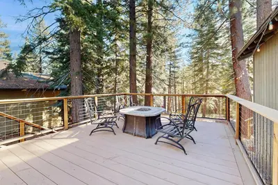 a wooden deck with a table and chairs on it at Lazy Bear Retreat in Mevers