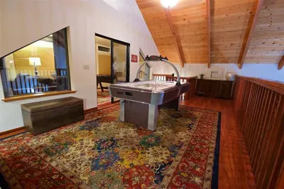 a living room with a sink on a rug at Mountain View Playhouse Near Yosemite & Bass Lake in Oakhurst