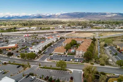 an aerial view of a city with mountains in the background at Sonesta ES Suites Reno in Reno