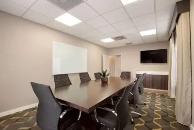 a conference room with a long table and chairs at Sonesta ES Suites Reno in Reno