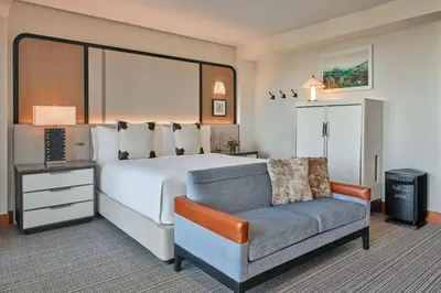 a hotel room with a bed and a chair at The Ritz-Carlton, Lake Tahoe in Truckee