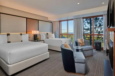a hotel room with a bed and a couch at The Ritz-Carlton, Lake Tahoe in Truckee