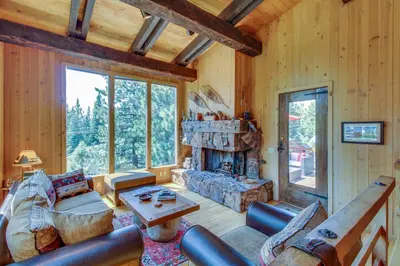 a living room with a couch and a fireplace at Commonwealth Retreat in Kings Beach