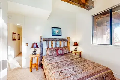 a bedroom with a bed and a window at Commonwealth Retreat in Kings Beach
