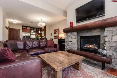 a living room with a couch and a fireplace at Juniper Crest 3 in Old Mammoth