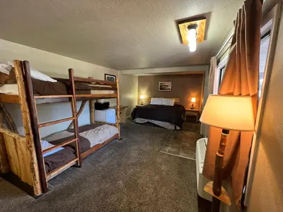 a room with two bunk beds and a bed at The Trailhead in South Lake Tahoe