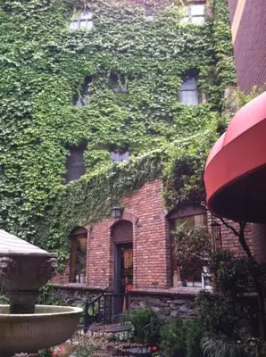 a brick building with ivy growing on the side of it at Historic Cary House Hotel in Placerville