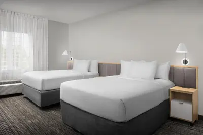 a hotel room with two beds and a window at TownePlace Suites Sacramento Cal Expo in Sacramento