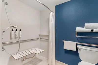 a bathroom with a shower and a toilet at Country Inn & Suites by Radisson, Modesto-Salida in Modesto