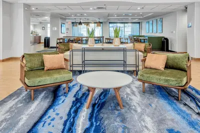 a waiting room with two chairs and a table at Fairfield Inn & Suites Rancho Cordova in Rancho Cordova