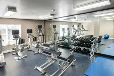 a gym with several treadmills and exercise machines at Residence Inn by Marriott Stockton in Stockton