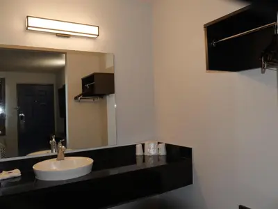 a bathroom with a sink and a mirror at Motel 6-Sacramento, CA - South Sacramento and Elk Grove in Sacramento