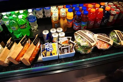 a refrigerator filled with different types of drinks at Hyatt Place Delano in Delano